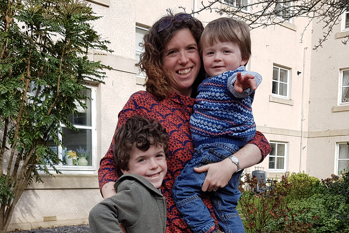 mum and her 2 children smiling