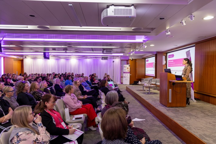 woman presenting to conference